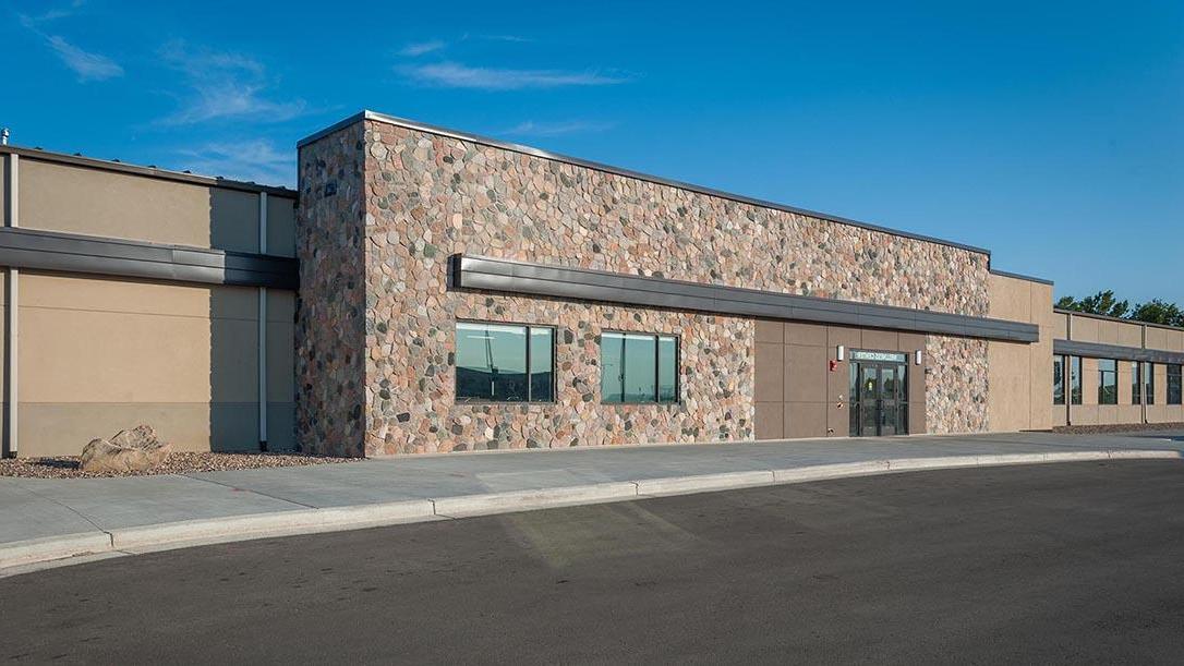 Exterior photo of the fieldhouse on the University of Mary campus.